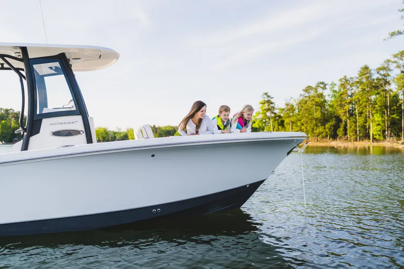 Slide: The Image of Family enjoying a day on a 2027 Sea Hunt Ultra 265SE boat. - 34