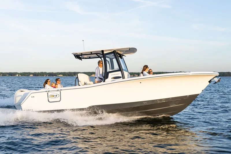 Slide: The Image of 2027 Sea Hunt Ultra 265SE boat cruising on a sunny day with passengers onboard. - 42