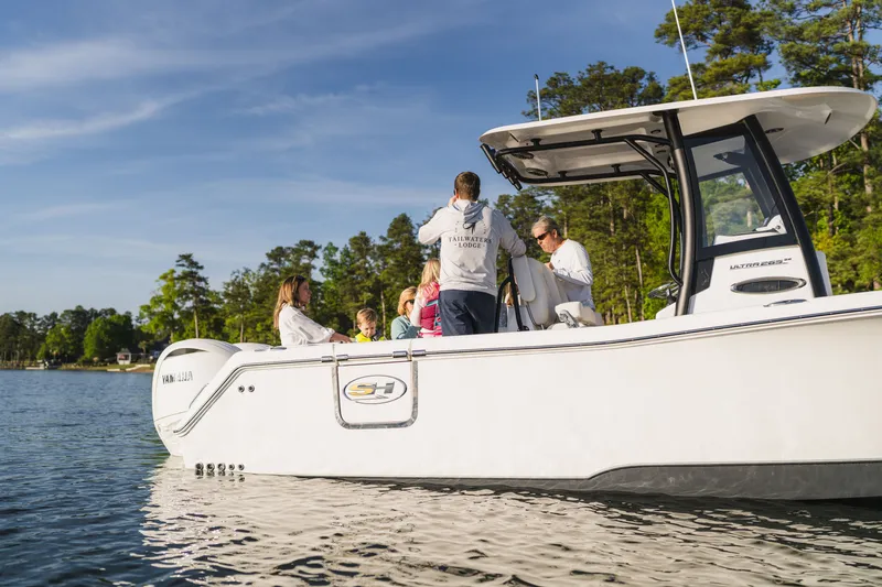 Slide: The Image of Family enjoying a day on a 2027 Sea Hunt Ultra 265SE boat. - 28