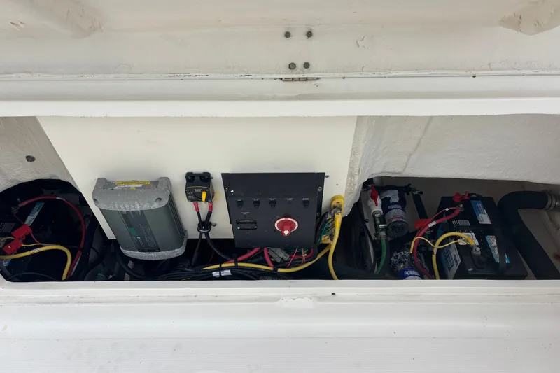 Slide: The Image of Electrical components and wiring inside a 2011 Robalo R227 Dual Console boat. - 15