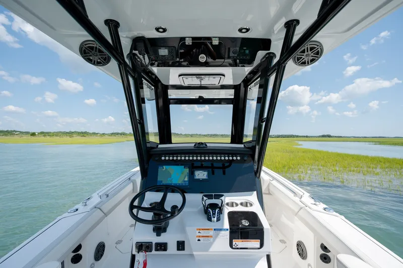 Slide: The Image of Interior view of 2026 World Cat 265 CC-X boat cockpit with navigation system. - 22