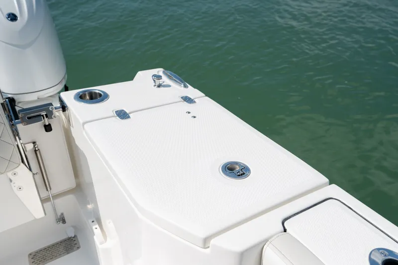 Slide: The Image of 2026 World Cat 265 CC-X boat deck detail with cup holder and latch. - 45