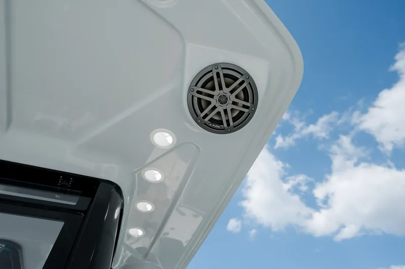 Slide: The Image of Speaker and lights on 2026 World Cat 265 CC-X boat against blue sky. - 27