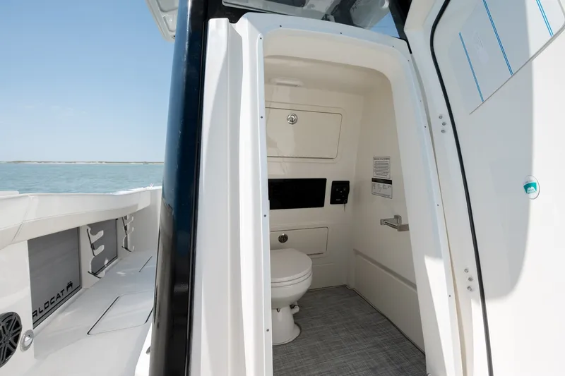 Slide: The Image of Interior view of 2026 World Cat 265 CC-X boat's compact bathroom with modern amenities. - 33