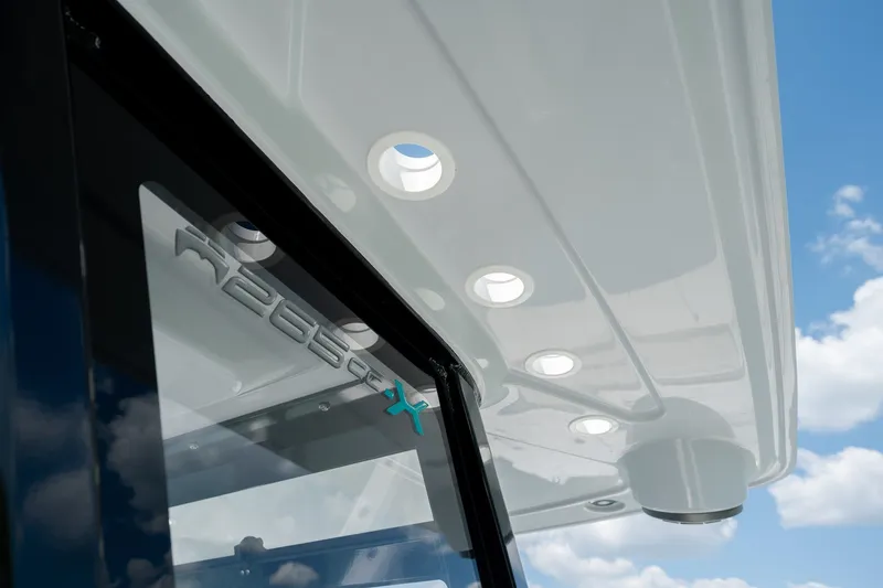 Slide: The Image of 2026 World Cat 265 CC-X boat detail with sleek design and modern lighting. - 28