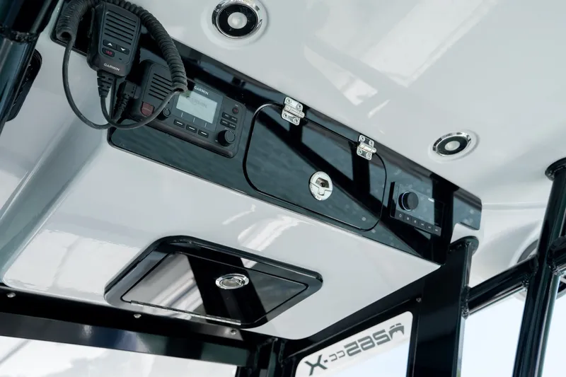 Slide: The Image of 2026 World Cat 265 CC-X boat console with radio and control panel. - 25
