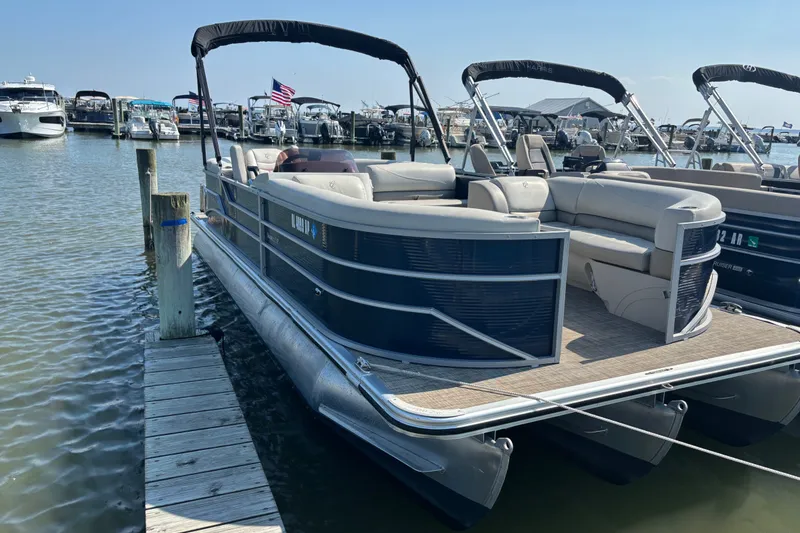 The Image of 2023 Cypress Cay Seabreeze 232 pontoon boat docked at marina, sunny day. - 1