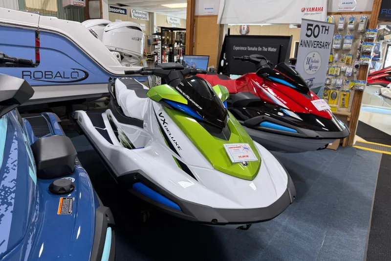The Image of 2026 Yamaha WaveRunner VX Deluxe jet skis displayed in a showroom. - 0