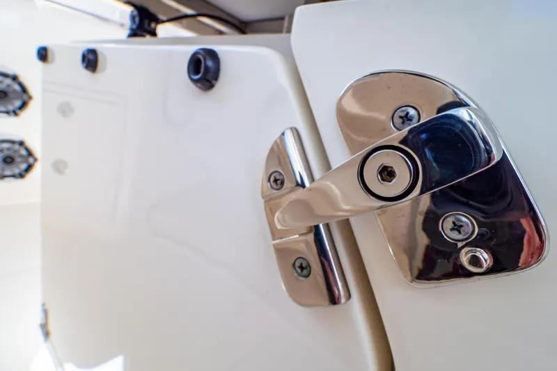 Slide: The Image of Close-up of a 2019 Boston Whaler 350 Realm boat latch detail. - 90