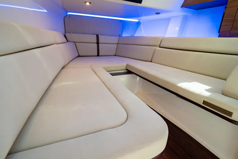 Slide: The Image of Luxurious interior seating of 2019 Boston Whaler 350 Realm boat with ambient lighting. - 29