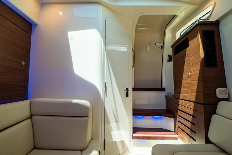 Slide: The Image of Luxurious interior of 2019 Boston Whaler 350 Realm with wood accents and seating. - 26