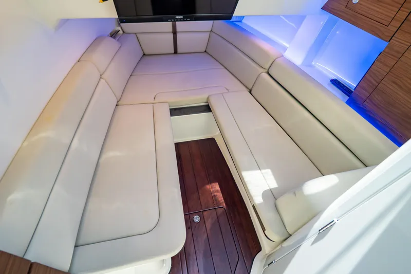 Slide: The Image of Luxurious interior of 2019 Boston Whaler 350 Realm with plush seating and wood flooring. - 20