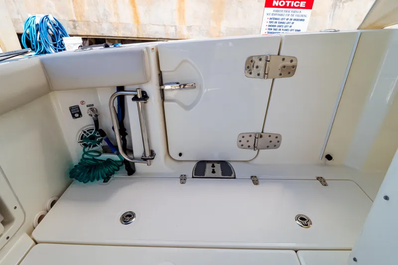 Slide: The Image of 2019 Boston Whaler 350 Realm boat deck with storage and safety features. - 61