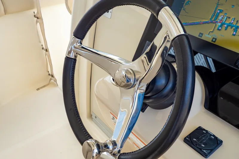 Slide: The Image of Steering wheel of 2019 Boston Whaler 350 Realm with navigation display. - 13