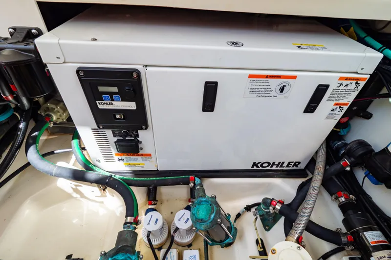 Slide: The Image of Kohler generator in 2019 Boston Whaler 350 Realm boat engine compartment. - 66