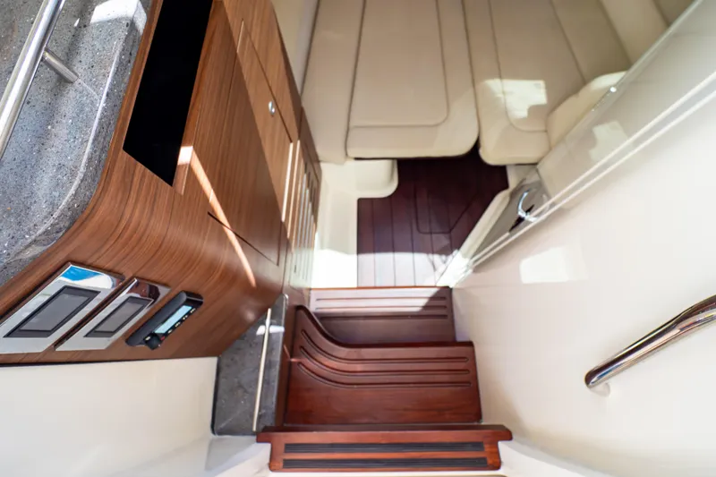 Slide: The Image of Luxurious interior of 2019 Boston Whaler 350 Realm with wooden cabinetry and seating area. - 39