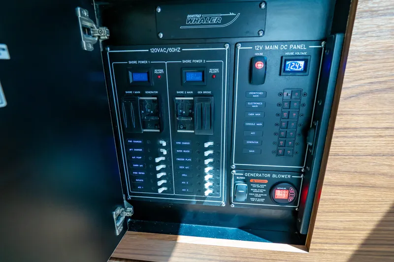 Slide: The Image of Electrical control panel of a 2019 Boston Whaler 350 Realm boat. - 35