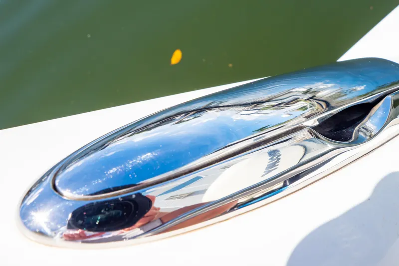 Slide: The Image of Close-up of a polished chrome cleat on a 2019 Boston Whaler 350 Realm boat. - 46