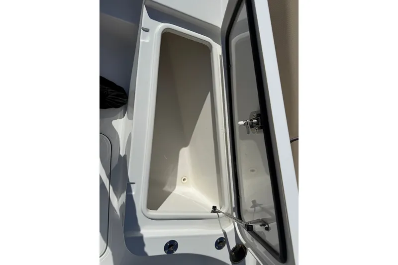 Slide: The Image of Open storage compartment on a 2018 Sea Hunt Gamefish 27 boat. - 31