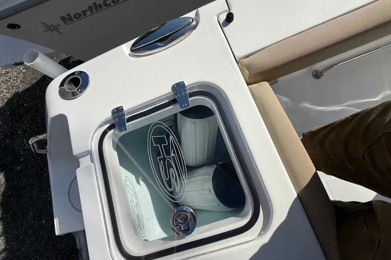 Slide: The Image of 2018 Sea Hunt Gamefish 27 boat interior with storage compartment and seating. - 23