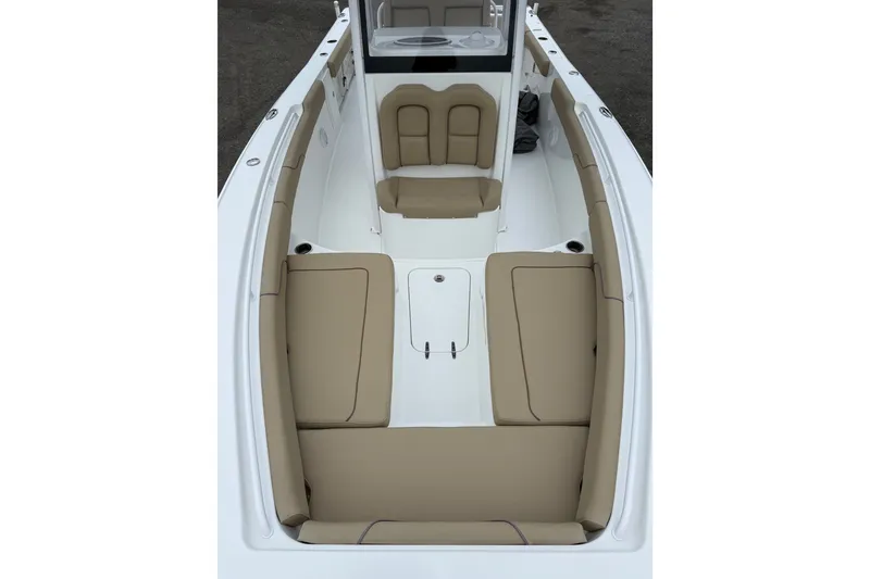 Slide: The Image of 2018 Sea Hunt Gamefish 27 boat interior with tan seating and white deck. - 13