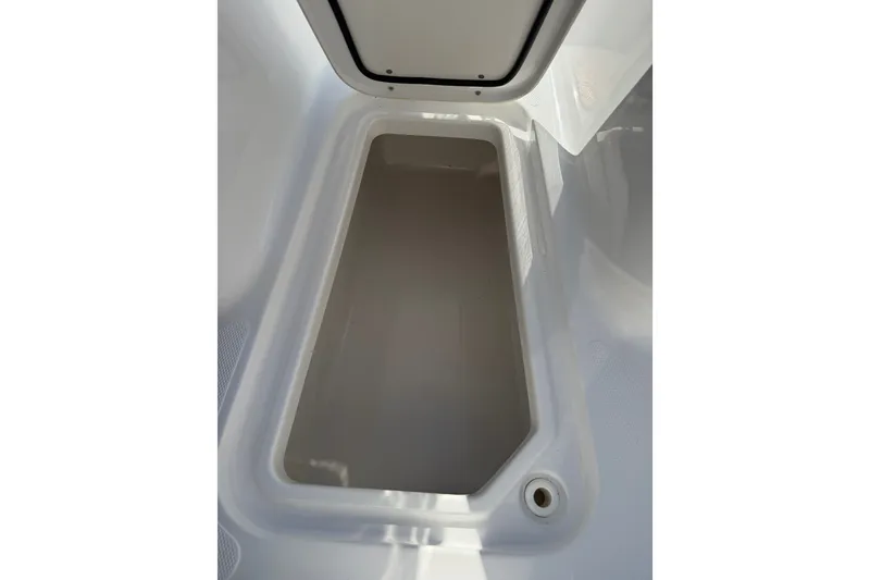 Slide: The Image of Storage compartment of a 2018 Sea Hunt Gamefish 27 boat, open and empty. - 28