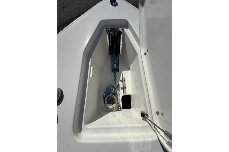 Slide: The Image of 2018 Sea Hunt Gamefish 27 anchor compartment with chain and winch system. - 30