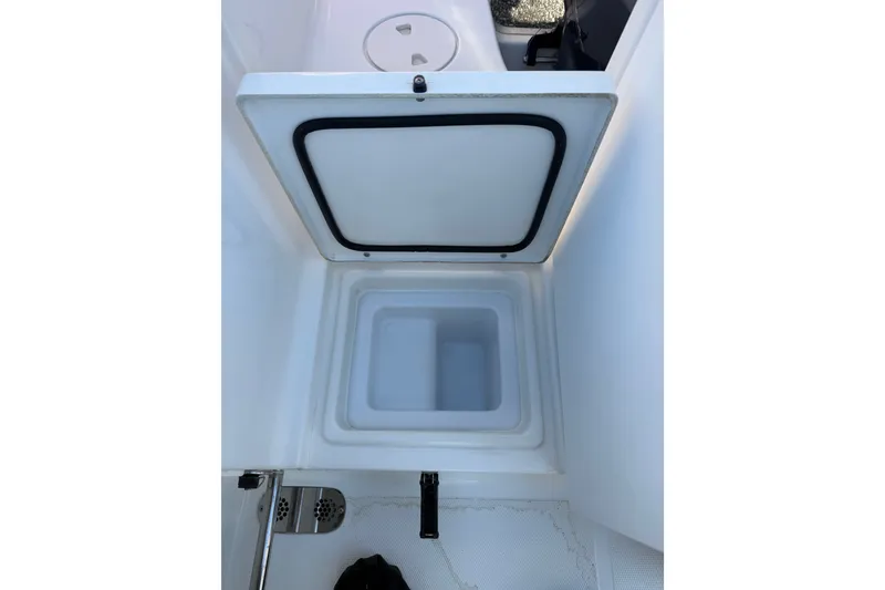 Slide: The Image of Open storage compartment on a 2018 Sea Hunt Gamefish 27 boat. - 20