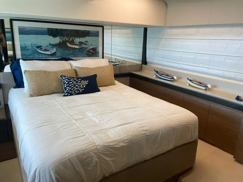 Slide: The Image of Luxurious bedroom in 2016 Ferretti Yachts 550 with nautical decor and large bed. - 18