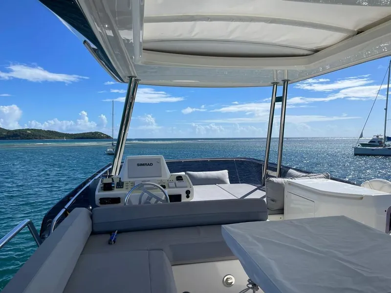Slide: The Image of Ferretti Yachts 550 (2016) luxury yacht interior with ocean view and blue skies. - 9