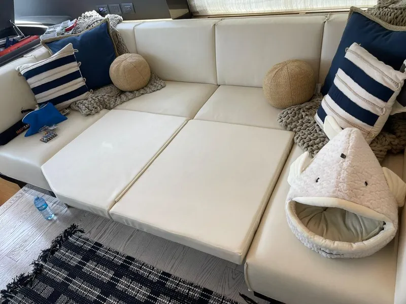 Slide: The Image of Luxurious white leather seating area on a 2016 Ferretti Yachts 550. - 13