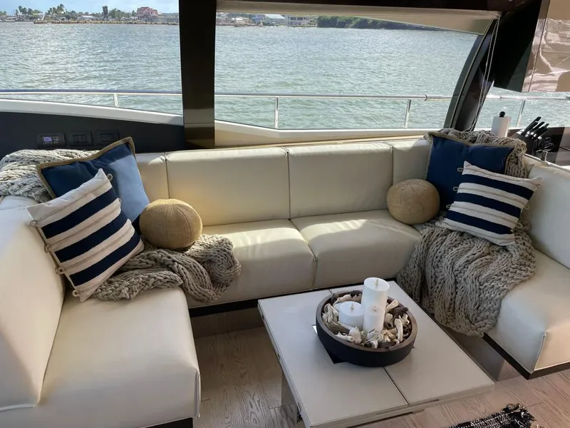 Slide: The Image of Luxurious interior of 2016 Ferretti Yachts 550 with cozy seating and nautical decor. - 14