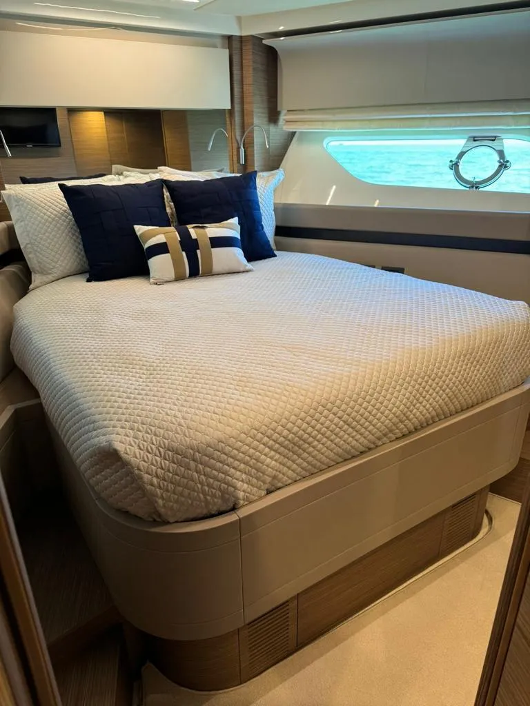 Slide: The Image of Luxurious bedroom interior of 2016 Ferretti Yachts 550 with modern decor and ocean view. - 17