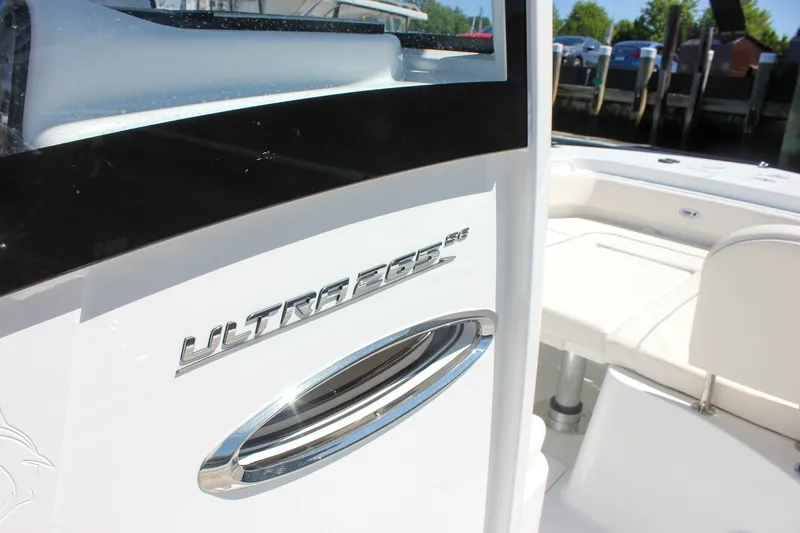 Slide: The Image of 2027 Sea Hunt Ultra 265SE boat, sleek design with chrome detailing. - 32