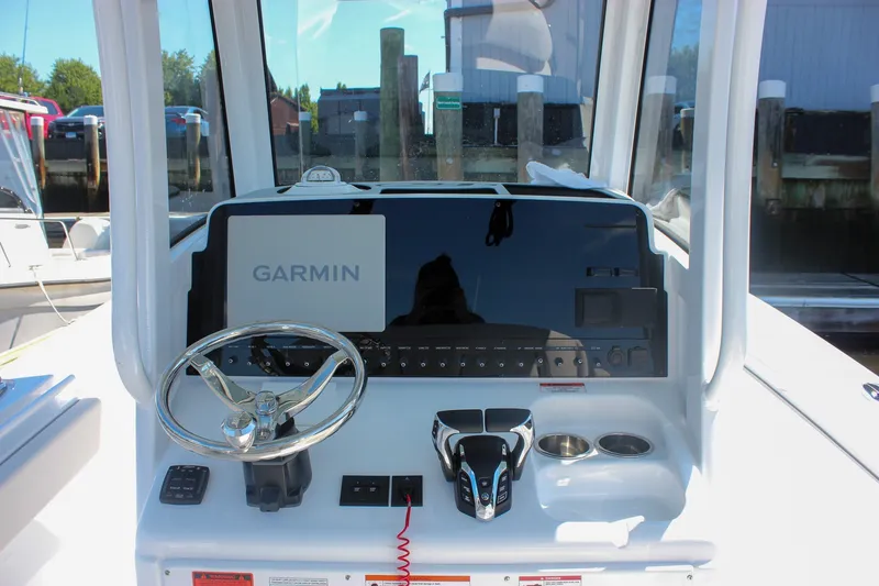 Slide: The Image of Helm of 2027 Sea Hunt Ultra 265SE with Garmin navigation system. - 19