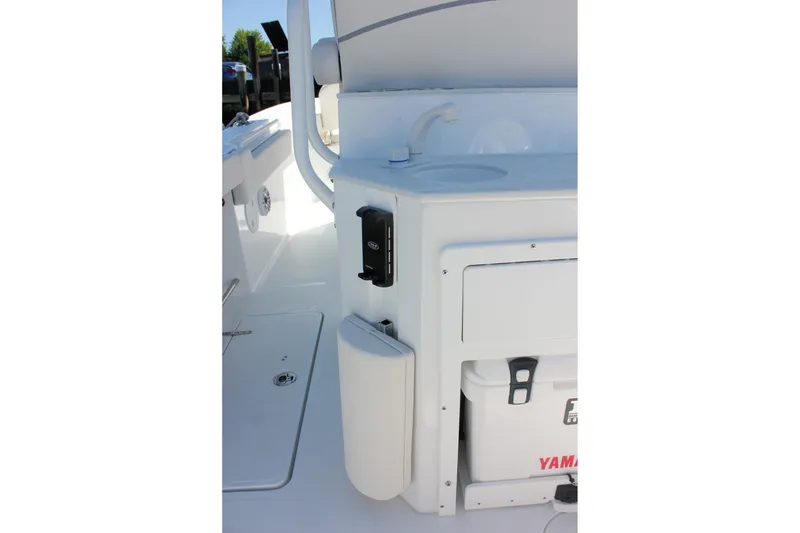 Slide: The Image of Interior view of 2027 Sea Hunt Ultra 265SE boat featuring a sink and storage area. - 15