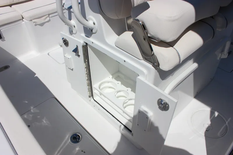 Slide: The Image of Interior of 2027 Sea Hunt Ultra 265SE boat featuring storage compartment and seating. - 24