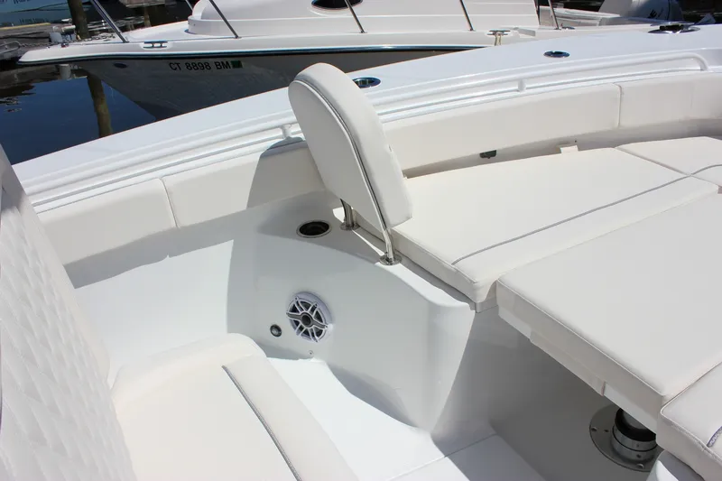 Slide: The Image of Interior of 2027 Sea Hunt Ultra 265SE boat with white seating and speaker. - 36