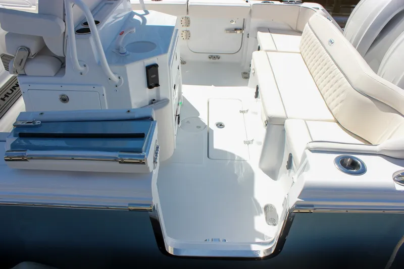 Slide: The Image of 2027 Sea Hunt Ultra 265SE boat interior with seating and storage features. - 4