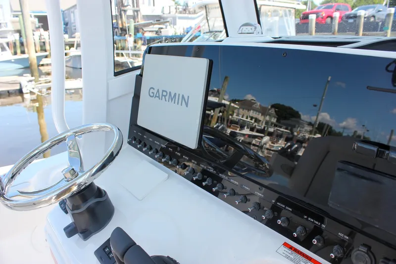 Slide: The Image of Control panel of 2027 Sea Hunt Ultra 265SE boat with Garmin navigation system. - 28