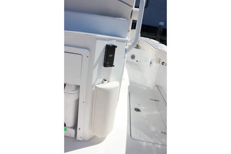 Slide: The Image of 2027 Sea Hunt Ultra 265SE boat interior, featuring sleek white design and modern amenities. - 16