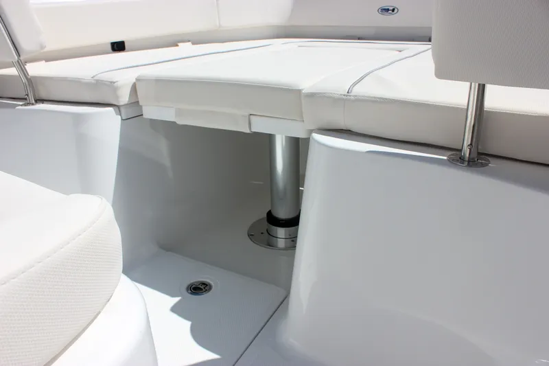 Slide: The Image of Interior seating of 2027 Sea Hunt Ultra 265SE boat, featuring white upholstery. - 35