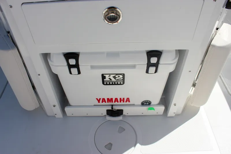 Slide: The Image of White K2 cooler with Yamaha branding on Sea Hunt Ultra 265SE boat, 2027 model. - 14