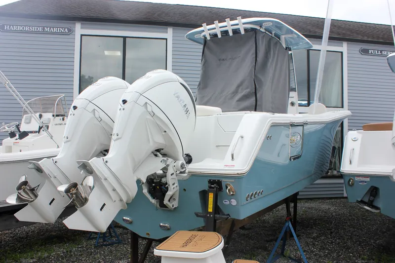 Slide: The Image of 2027 Sea Hunt Ultra 265SE boat with dual outboard engines at Harborside Marina. - 47