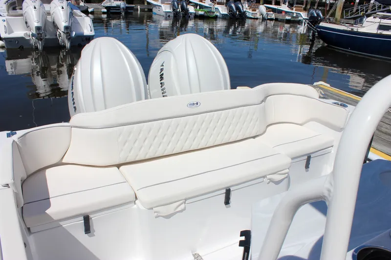 Slide: The Image of 2027 Sea Hunt Ultra 265SE boat with Yamaha engines, featuring elegant white seating. - 6
