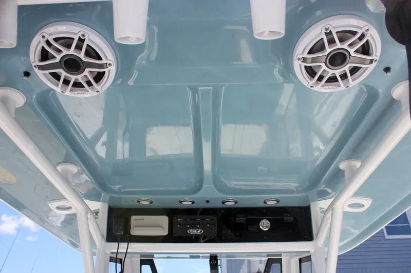 Slide: The Image of 2027 Sea Hunt Ultra 265SE boat roof with speakers and electronic equipment. - 21