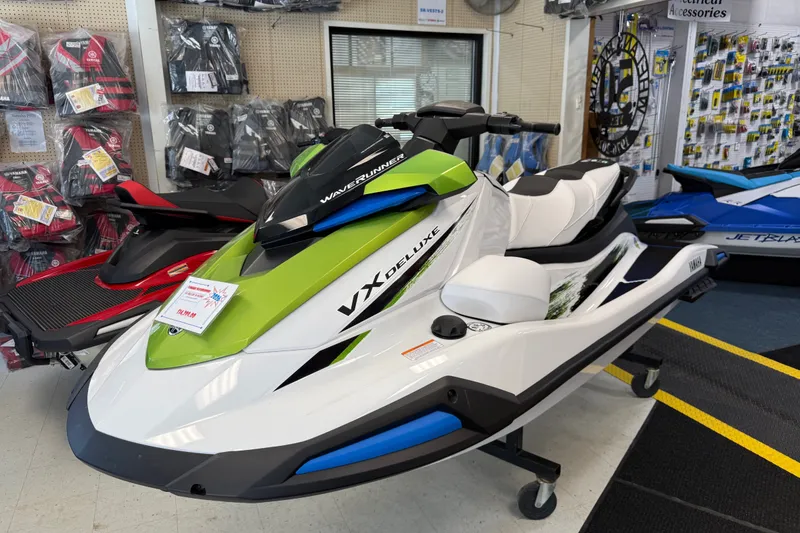 Slide: The Image of 2026 Yamaha WaveRunner VX Deluxe in showroom, featuring sleek design and vibrant colors. - 1
