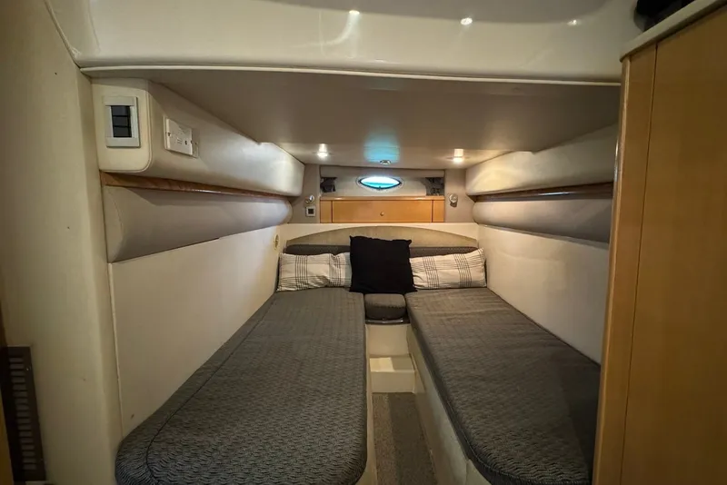 Slide: The Image of Interior cabin of 2004 Maxum 4200 SY yacht with twin beds and cozy decor. - 9
