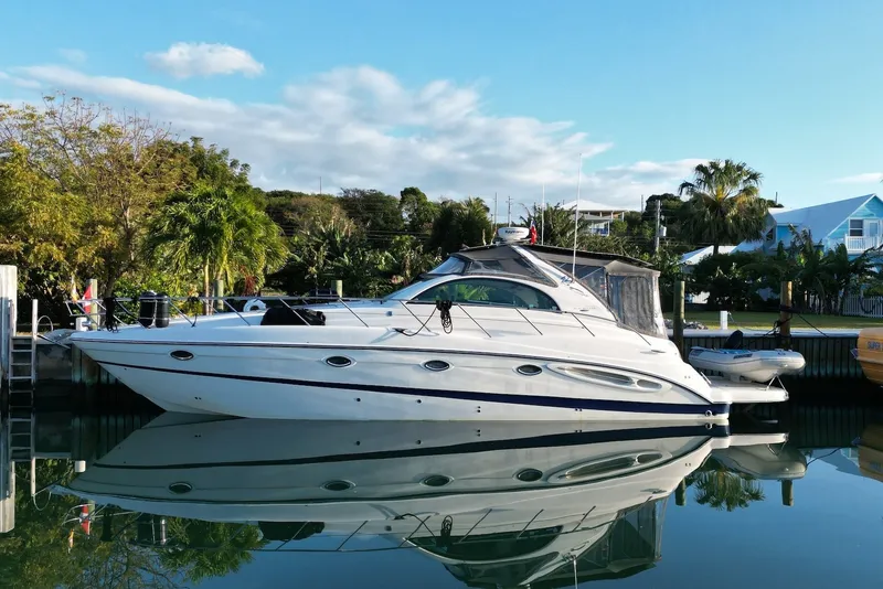 The Image of 2004 Maxum 4200 SY yacht docked in a serene marina setting. - 0