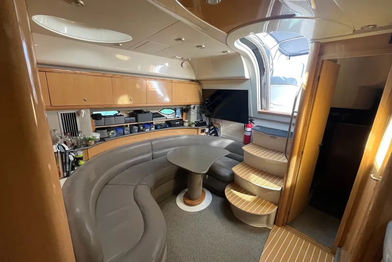 Slide: The Image of Luxurious interior of 2004 Maxum 4200 SY yacht with curved seating and modern amenities. - 7